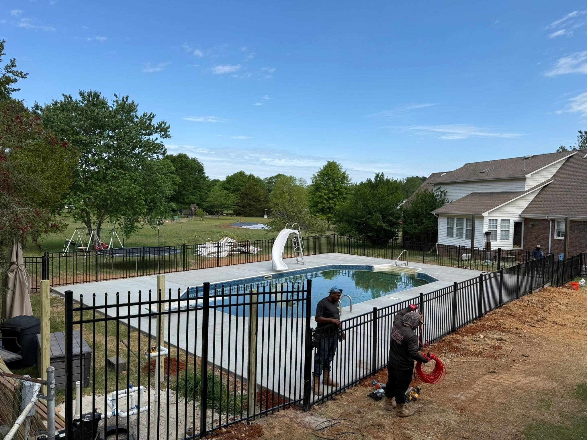 Black ornamental metal pool safety fence installation near Muscle Shoals, AL Black ornamental metal pool safety fence installation near Muscle Shoals, AL