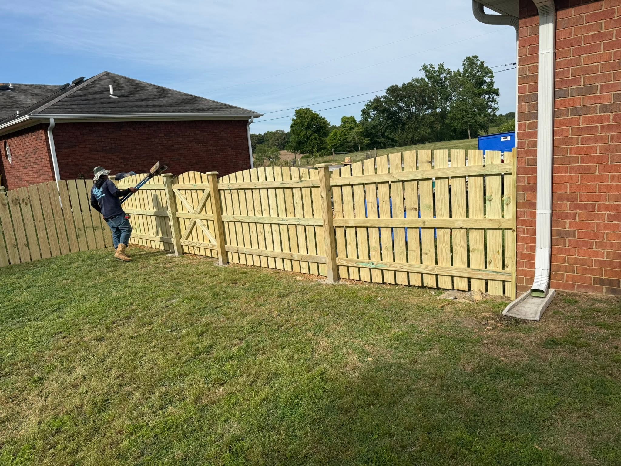 Scalloped wood fence and gate install with Vaughn Fence crew in Northern Alabama Scalloped wood fence and gate install with Vaughn Fence crew in Northern Alabama
