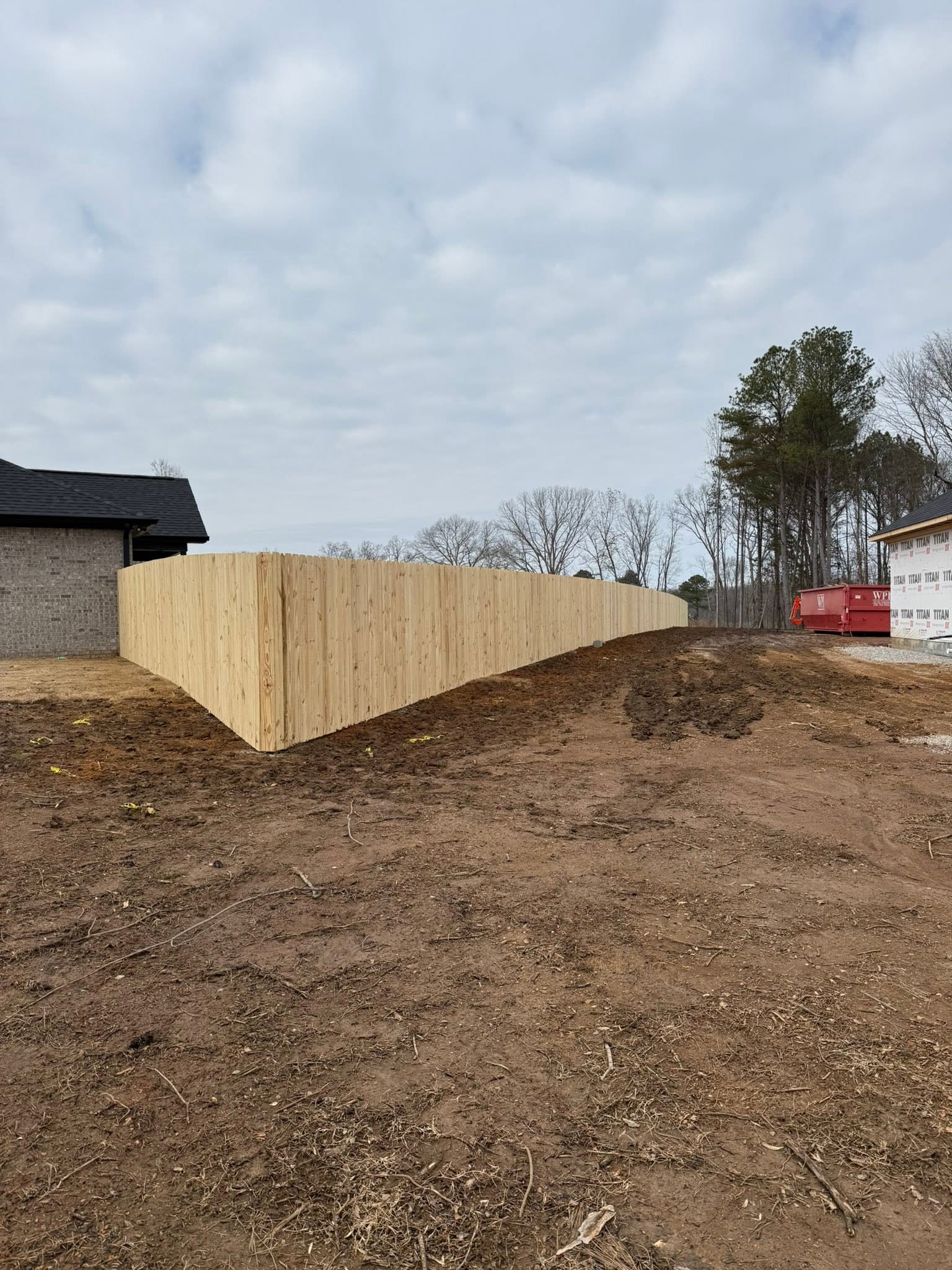 New-construction wood privacy fence perimeter in Muscle Shoals, AL New-construction wood privacy fence perimeter in Muscle Shoals, AL