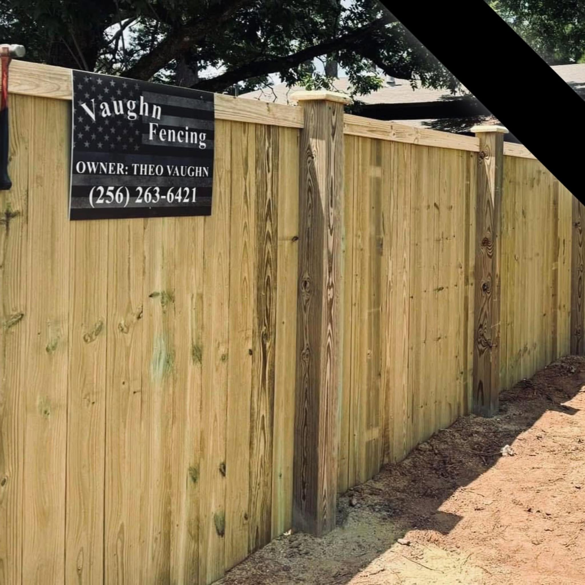 Vaughn Fence job-site wood privacy fence with company sign in Muscle Shoals, AL Vaughn Fence job-site wood privacy fence with company sign in Muscle Shoals, AL