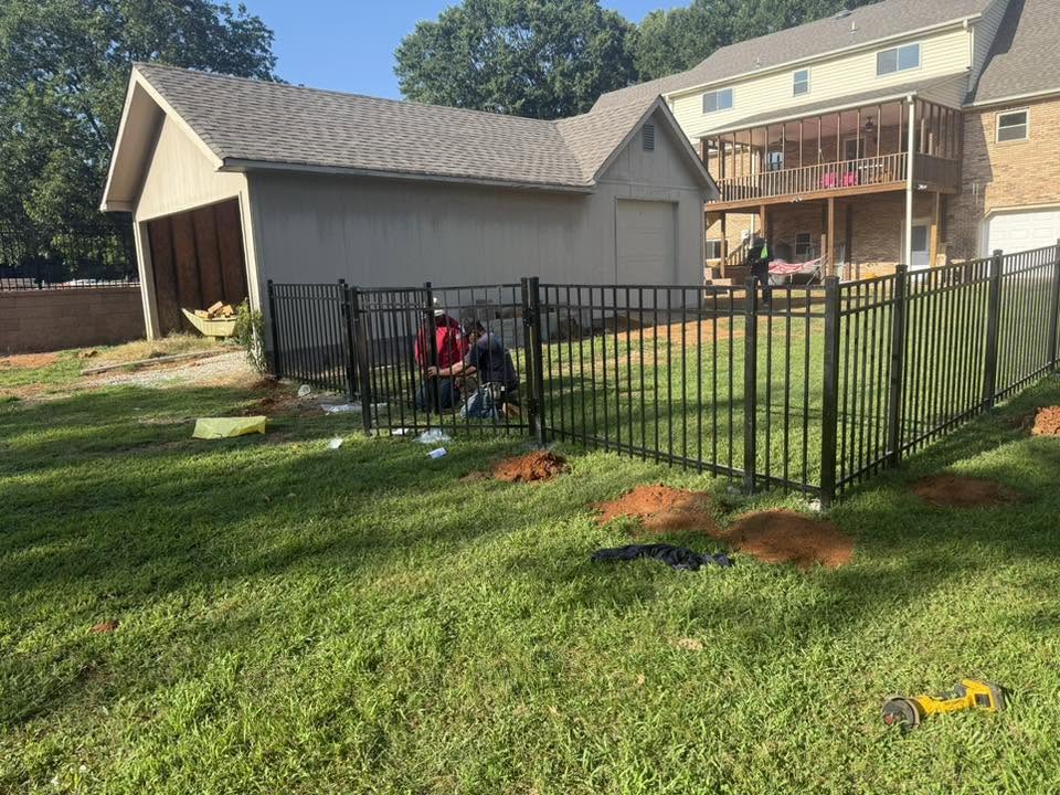 Vaughn Fence crew installing black ornamental metal fencing in Northern Alabama Vaughn Fence crew installing black ornamental metal fencing in Northern Alabama